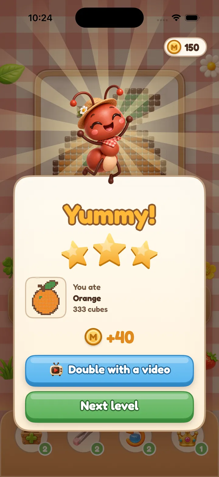 Victory panel: “Yummy!” with three stars, the orange picture you ate and 40 coins.